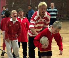 Japanese member teaches Welsh boys how to play rugby